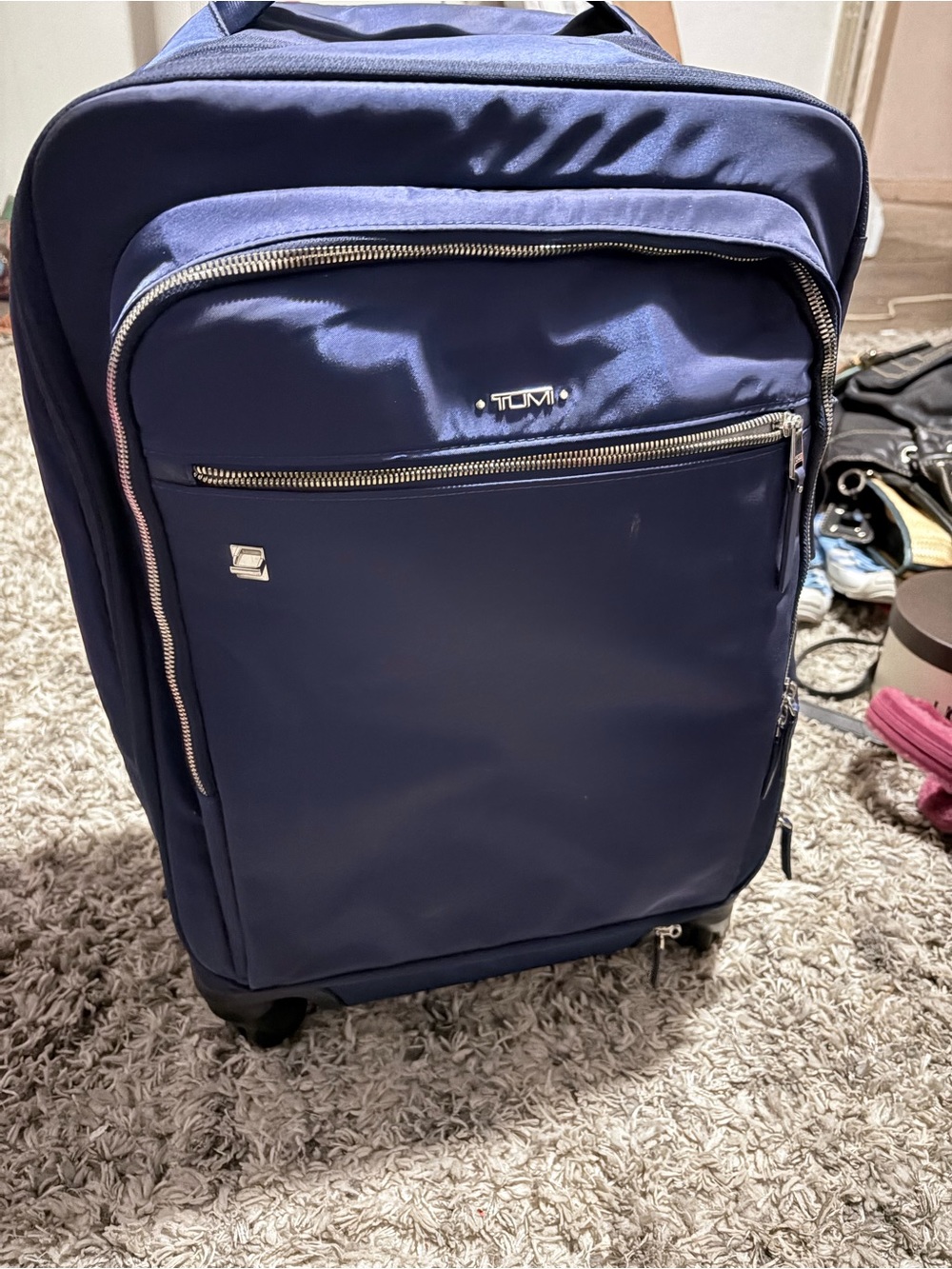 Tumi Navy Soft-Sided Carry-On Spinner rolling luggage